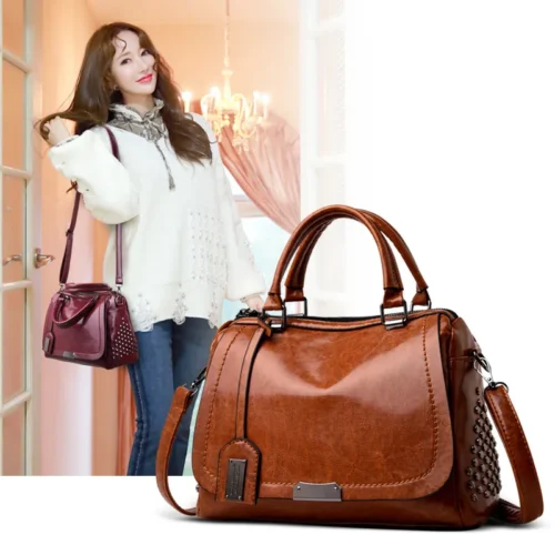 2019 New Korean rivet women's bag large capacity portable shoulder diagonal bag oil leather Boston bag wholesale
